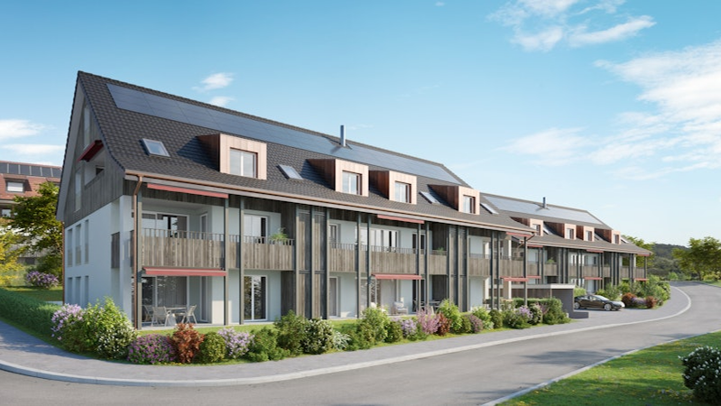 Neubau Mehrfamilienhäuser in Uesslingen-Buch - STRABAG Holzbau Bild von Mehrfamilienhäusern mit Solarpanel und Holzverkleidung