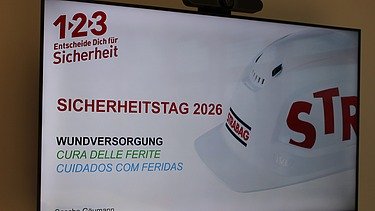 Präsentationsfolie zum STRABAG Sicherheitstag 2026 mit Thema Wundversorgung.