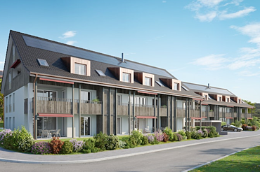 Neubau Mehrfamilienhäuser in Uesslingen-Buch - STRABAG Holzbau Bild von Mehrfamilienhäusern mit Solarpanel und Holzverkleidung
